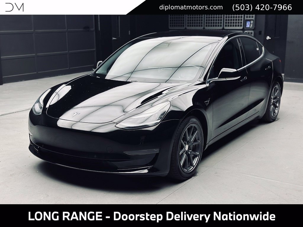 tesla model 3 2018 5YJ3E1EB9JF092999 image tesla model 3 2018 5YJ3E1EB9JF092999 image